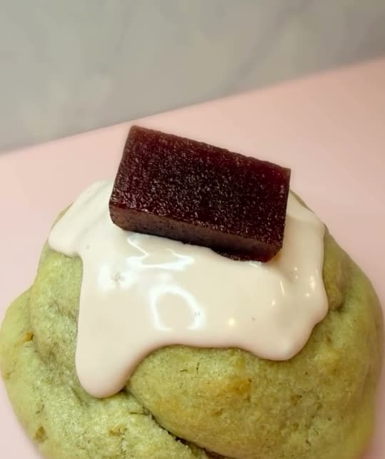 Guava stuffed cookie with cream drizzle and a slice of guava paste